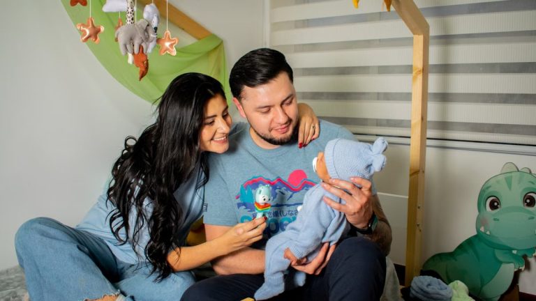 A happy family enjoys a cozy moment in the baby's nursery, filled with love and warmth.